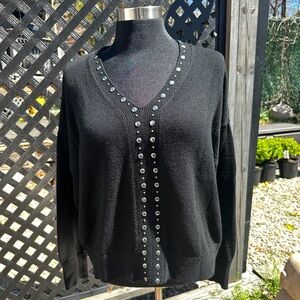 Rebecca minkoff silver studded sweater size small but can fit a size medium too.